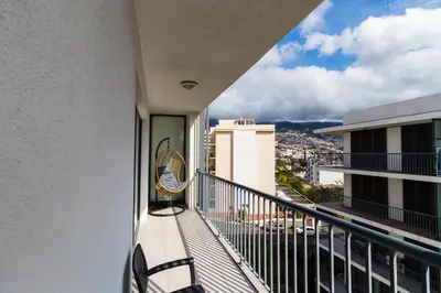 a balcony with a view of a city at Acacia Apartment by Atlântica in Funchal