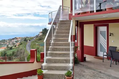 a set of stairs leading up to a house with a view at Casa da Piedade, a Home in Madeira in Ponta do Sol