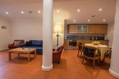 a living room with a couch and a table at Apartments Madeira in Caniço