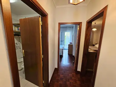 a hallway with a door open to a room at SAO PEDRO APARTMENT in Santa Cruz