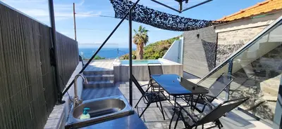 a balcony with a sink and a swimming pool at Casas Floeca in Ponta do Sol