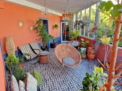 a patio with a bunch of potted plants at ASPA Studios - Urban Conscious Living in Funchal
