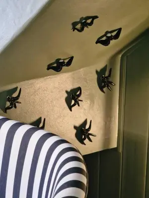 a wall with black bird decals on a wall at ASPA Studios - Urban Conscious Living in Funchal