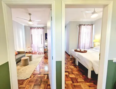 a bedroom with a bed and a living room at ASPA Studios - Urban Conscious Living in Funchal