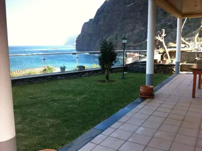 a view of the ocean from a balcony of a house at PDelgada 3-Bed House Sleeps 6 Parking & Sea View in Ponta Delgada