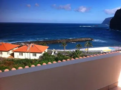 a view of the ocean from the balcony of a resort at PDelgada 3-Bed House Sleeps 6 Parking & Sea View in Ponta Delgada