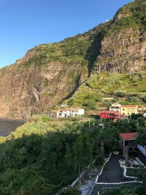 a mountain with houses on the side of a hill at PDelgada 3-Bed House Sleeps 6 Parking & Sea View in Ponta Delgada