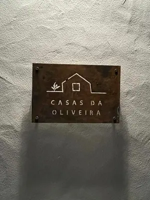 a sign for a house on a wall at Casa da Oliveira - Bordeira in Bordeira