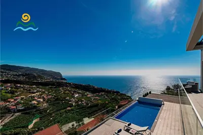 a view of the ocean from a house with a swimming pool at OurMadeira - Seacrest in Ponta do Sol