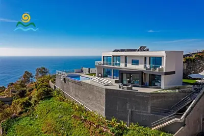 an image of a house with the ocean in the background at OurMadeira - Seacrest in Ponta do Sol