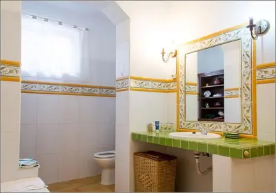 a bathroom with a sink and a mirror at Charming Villa with Heated Pool near Sandy Beach, Hiking, Golf and Wineries in Luz
