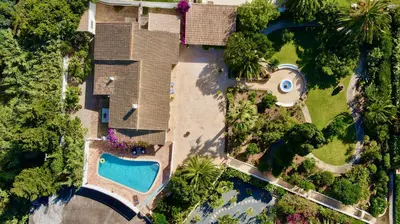 an overhead view of a house with a swimming pool at Charming Villa with Heated Pool near Sandy Beach, Hiking, Golf and Wineries in Luz