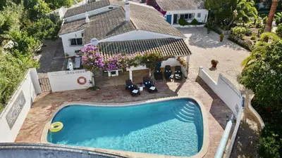 an overhead view of a swimming pool in front of a house at Charming Villa with Heated Pool near Sandy Beach, Hiking, Golf and Wineries in Luz
