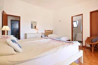 a bedroom with a large bed in a room at Villa Mirembe in Luz