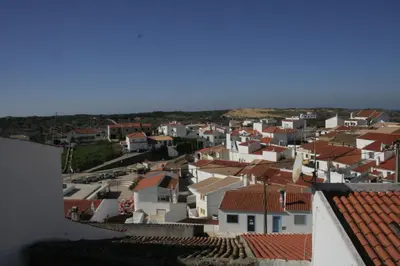 a group of white houses with red roofs at Beautiful Studio With Patio Carrapateira in Carrapateira