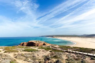 a view of a beach with a bridge and the ocean at Beautiful Studio With Patio Carrapateira in Carrapateira