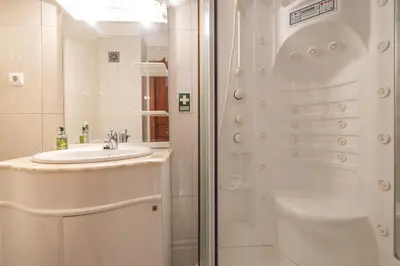 a bathroom with a sink and a shower at Casa Blanca II in Funchal