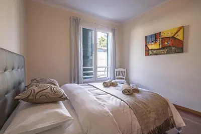a bedroom with a bed and a window at Casa Blanca II in Funchal