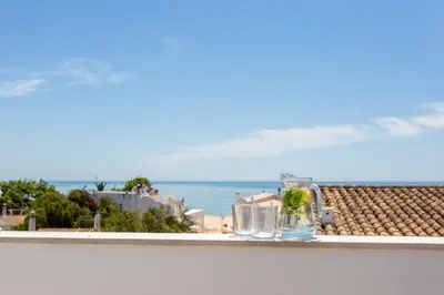 a view of the ocean from a balcony at Mariners (1) - Bright and stylish apartment - walk to the beach in Luz
