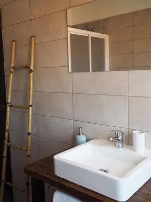a bathroom with a sink and a mirror at Casa Boa Onda in Sagres