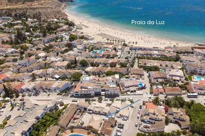 an aerial view of a beach with houses and condos at Cozy and sunny villa just some steps from the sea in Luz
