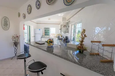 a kitchen with a large counter top in a room at Monte Lemos 29 in Luz
