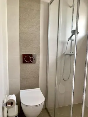 a bathroom with a toilet and a shower at Monte Lemos 29 in Luz