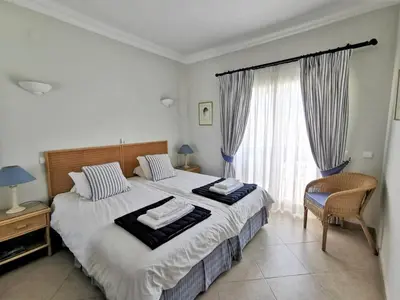 a bedroom with a bed with two towels on it at Boavista 73 in Lagos