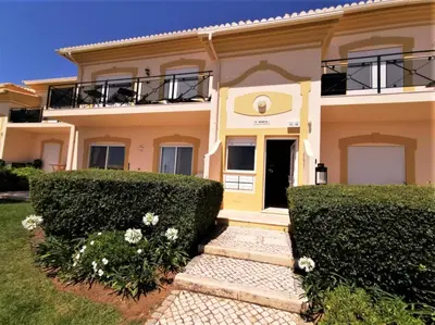 a house with bushes in front of it at Boavista 73 in Lagos