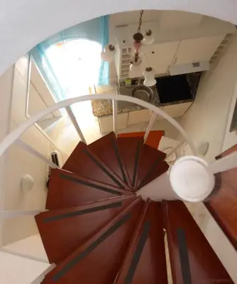 an overhead view of a spiral staircase in a house at Villa Erika Madeira in Caniço