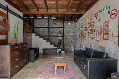 a living room with a couch and a table at The Rum Inn in Calheta