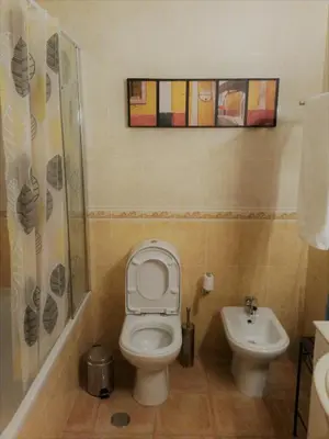a bathroom with a toilet and a sink at Casa Carmela in Burgau