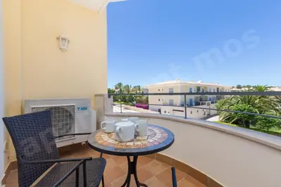 a balcony with a table and chairs on a balcony at Apartment Mos in Lagos