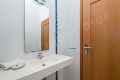 a bathroom with a sink and a mirror at Apartment Mos in Lagos