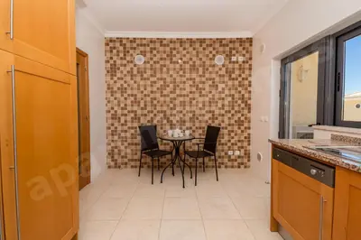 a dining room with a table and chairs at Apartment Mos in Lagos