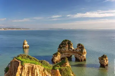 an island in the ocean with rocks in the water at Apartment Mos in Lagos