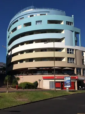 a building with a blue and white building at Cosy Studio at Lido with Pool in Funchal