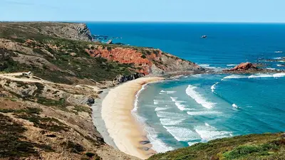 an aerial view of a beach on a cliff at Casa Flora T1 - Vila do Bispo in Vila do Bispo