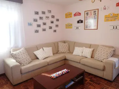a living room with a couch and a coffee table at Funchal petrolhead apartment in Funchal