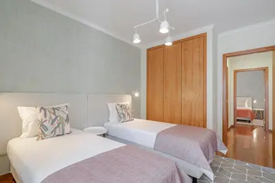 a hotel room with two beds and a window at Reis Magos IV by An Island Apart in Caniço