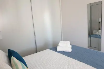 a bedroom with a bed with two towels on it at Sarah House in Funchal
