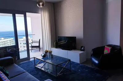 a living room with a couch and a tv at Sarah House in Funchal