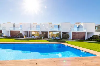 a house with a swimming pool in front of it at Villa Blue Sagres G in Sagres