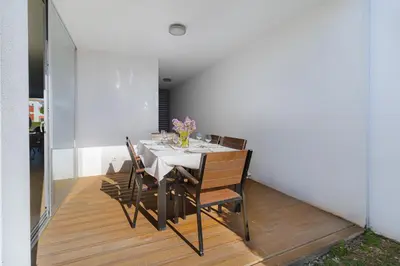 a dining room with a table and chairs at Villa Blue Sagres G in Sagres