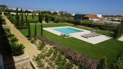 an overhead view of a garden with a swimming pool at Apartamento 7 Mares in Sagres