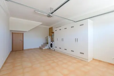 an empty living room with white walls and a ceiling at Boavista Resort - Casa Belinda in Lagos