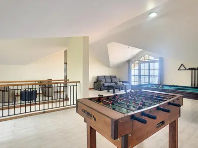 a living room with a large pool table at Casa Mes Amis by LovelyStay in Relógio do Poiso
