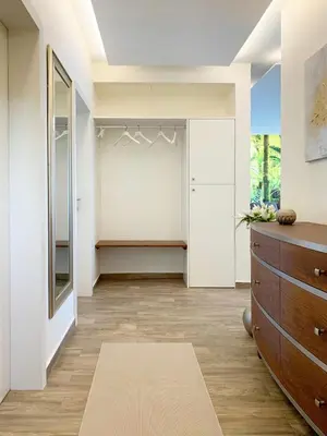 a dressing room with a mirror and a dresser at Holiday Apartment Sunset Ocean in Ribeira Brava