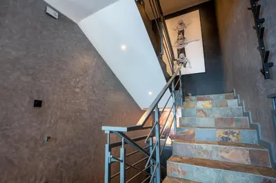 a staircase in a building with a stair case at Mansão Macau by LovelyStay in Arco da Calheta