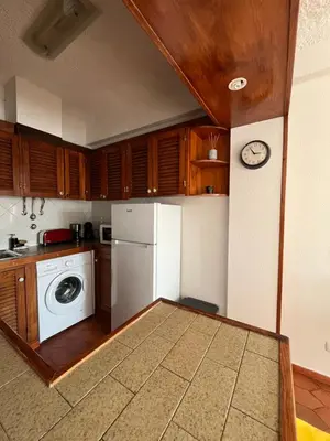 a kitchen with a white refrigerator and a dishwasher at Sea Light Seaview Vista Mar Apartment - Luz, Lagos in Luz